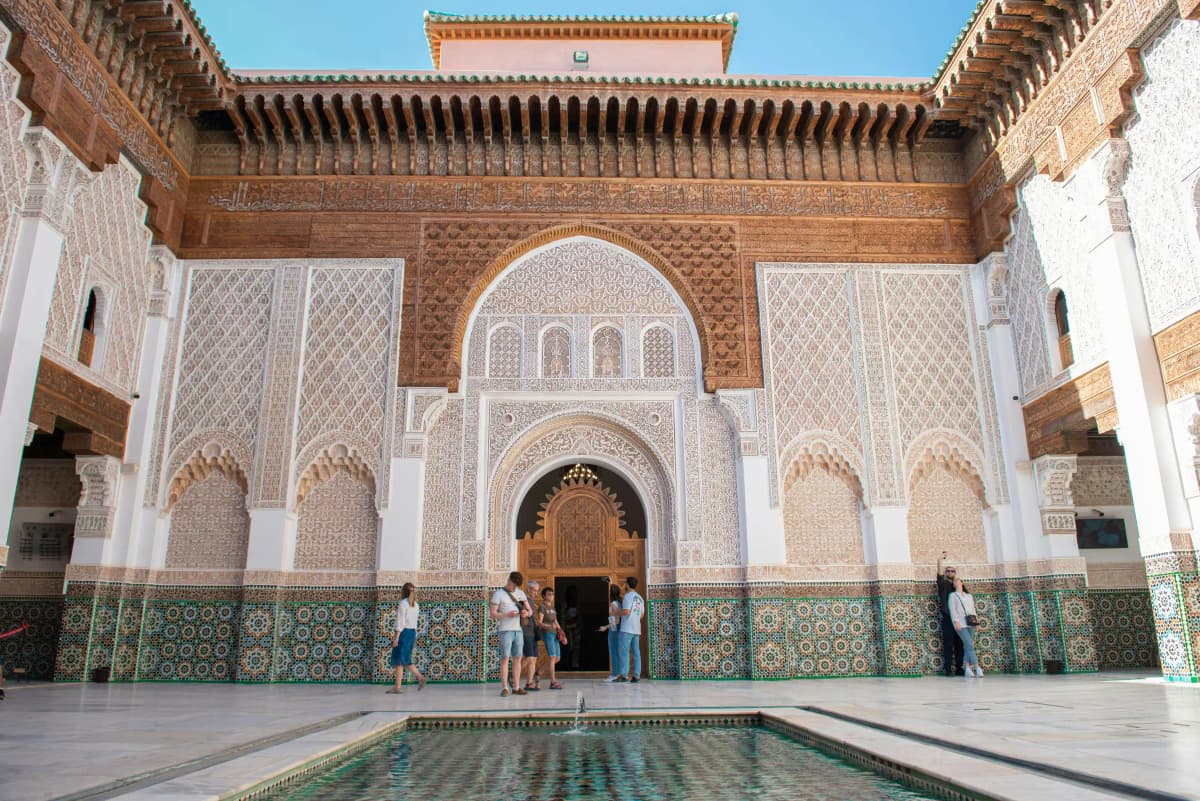 Marrakech tour guide walking through the historic Medina