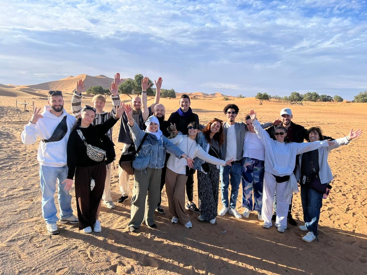 Marrakech Package travelers together in the Moroccan desert