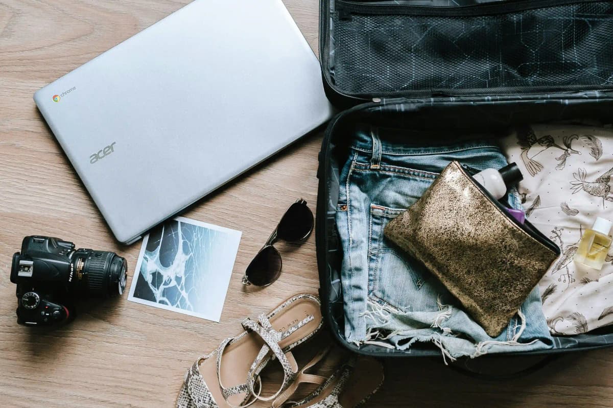 Travel essentials: hat, sunglasses, and camera